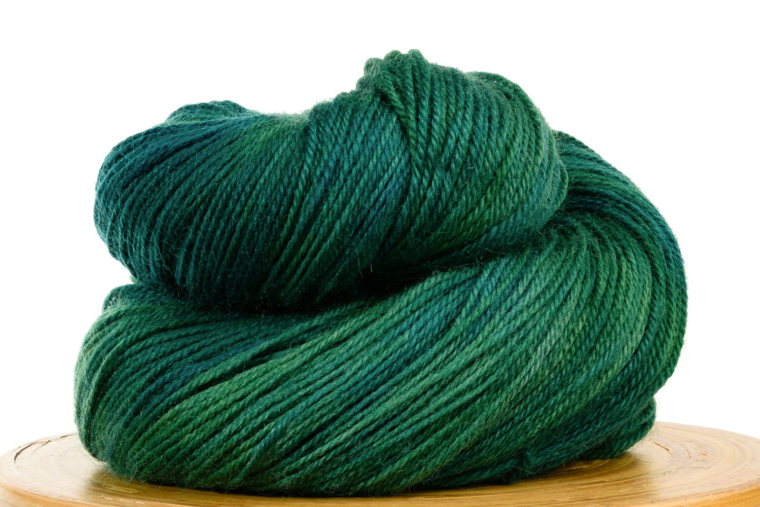 Pizzicato hand-dyed BFL sock yarn in Peacock