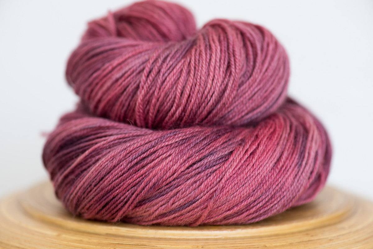 Pizzicato hand-dyed BFL sock yarn in Pink Clover