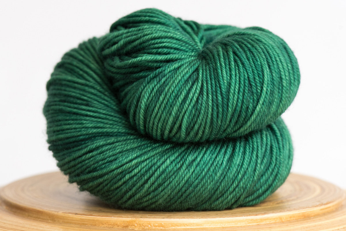 Emerald City vibrant green semi solid DK weight hand-dyed yarn