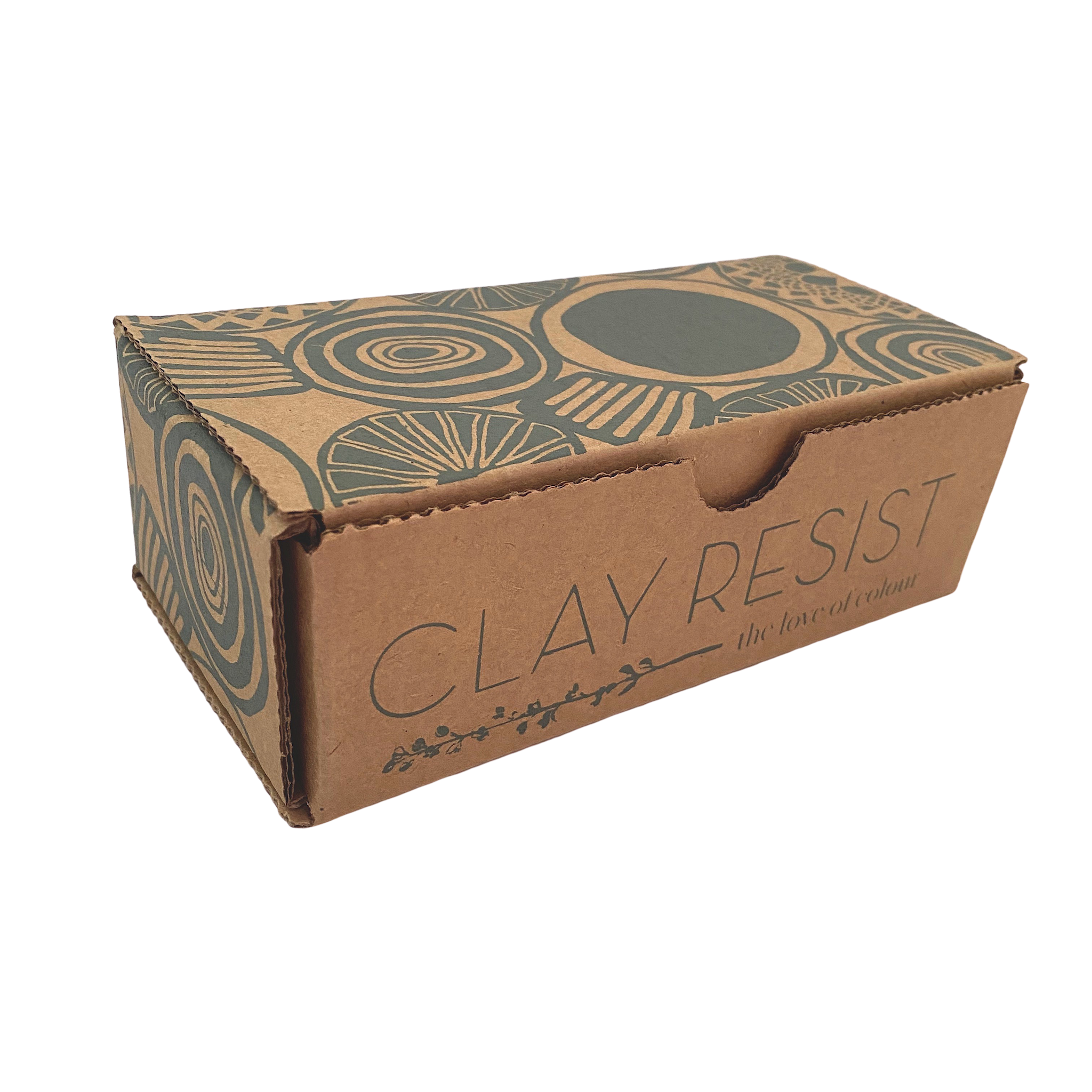 Cardboard box containing clay resist kit on white background. Box is printed with dark green circular motifs
