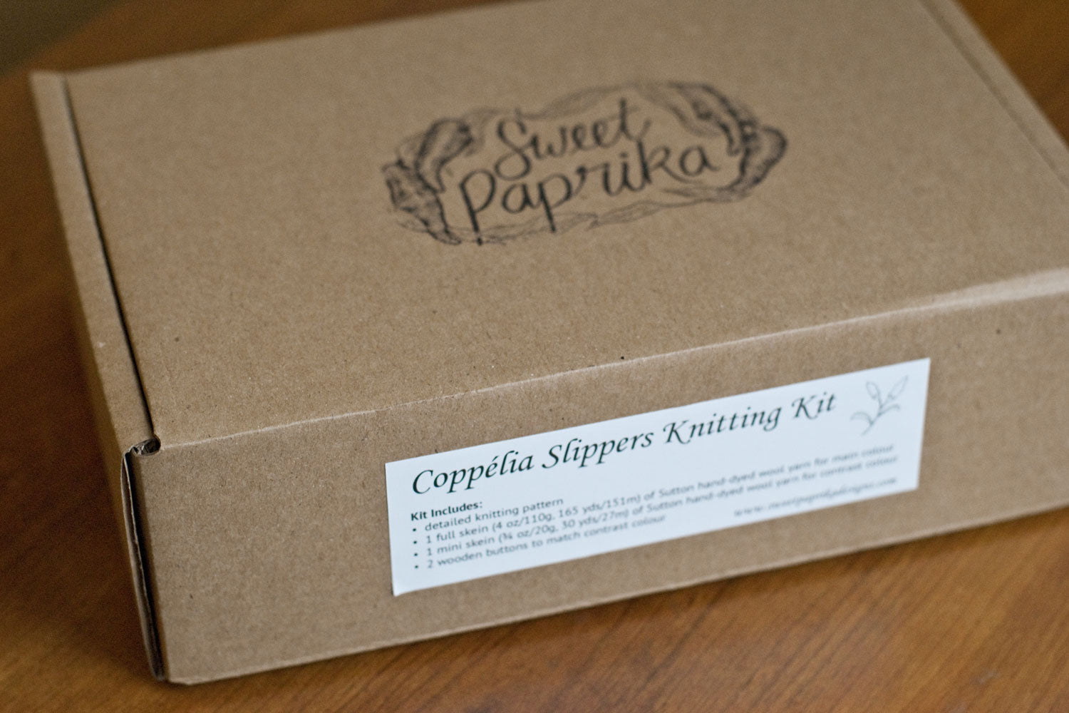 Cardboard box with sweet paprika stamp on top and slipper kit label on the side