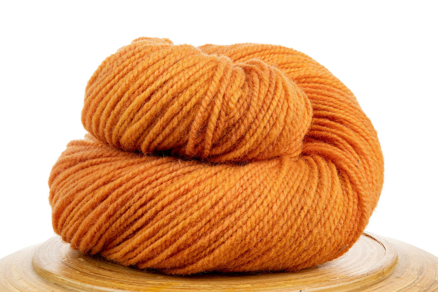 Winfield Canadian hand-dyed wool yarn in Zest, a bright orange